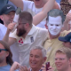 Crowd wearing Smith's mask